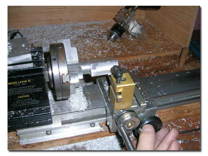 Barrel setup in 3-jaw chuck tho radius the top of the base.